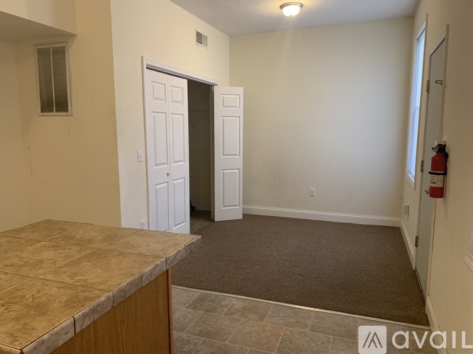 A room with a tiled floor and a counter top.