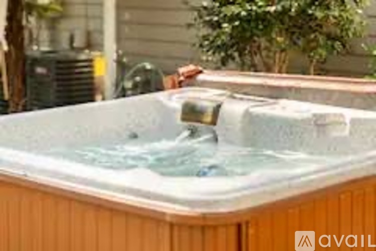 A hot tub with water flowing out of it.