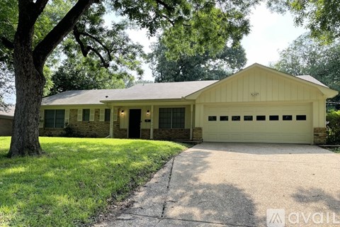 A two-car garage with a house attached is for sale.