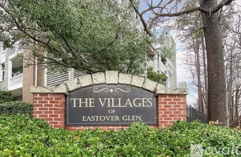 A sign that says "The Villages of Eastover Glen" is in front of some trees.