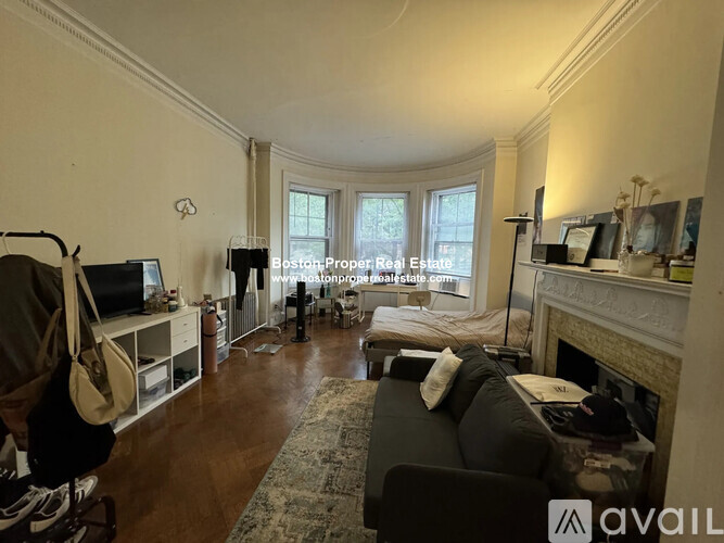 A living room with a fireplace and a couch.