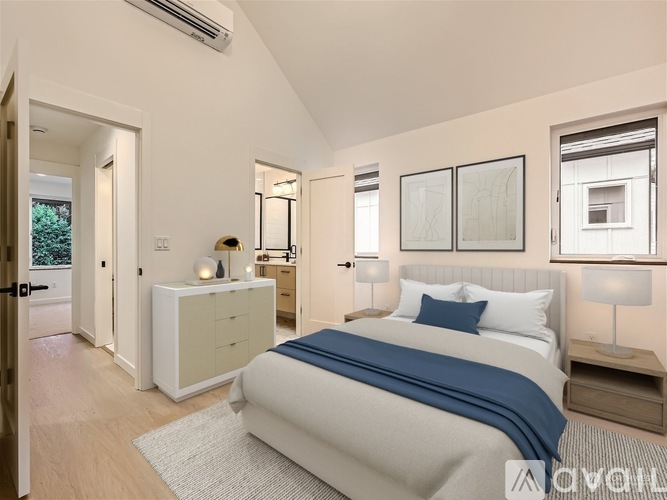A bedroom with a large bed and a white dresser.