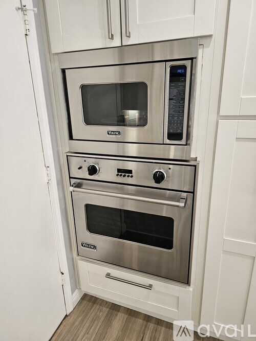 A stainless steel double oven built into a kitchen cabinet.