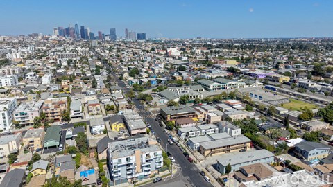 A cityscape with a mix of residential and commercial buildings.