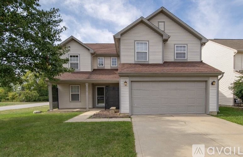 A house with a garage is for sale.