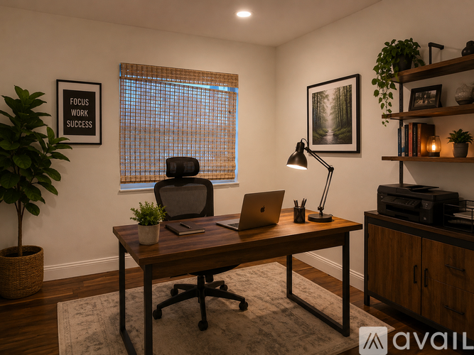 A well-lit office space with a desk, chair, and a motivational poster on the wall.