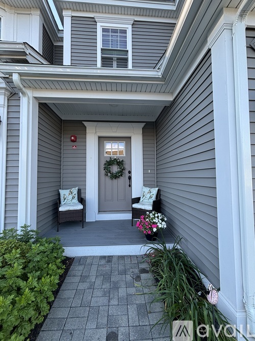 A house entrance with a wreath on the door.