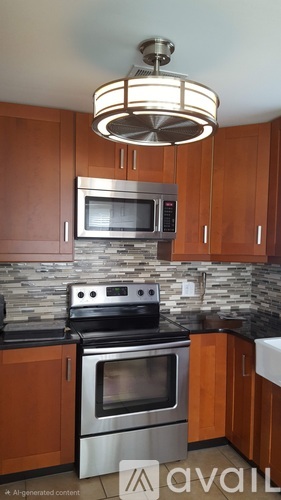 A kitchen with wooden cabinets and a stone backsplash.