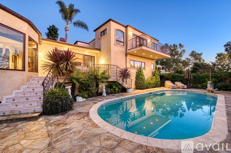 A house with a pool in the backyard.