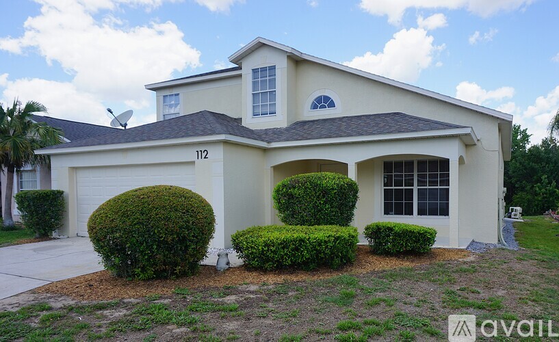 A house with the number 112 on it is for sale.