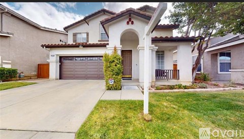 A house with a brown garage door is for sale.