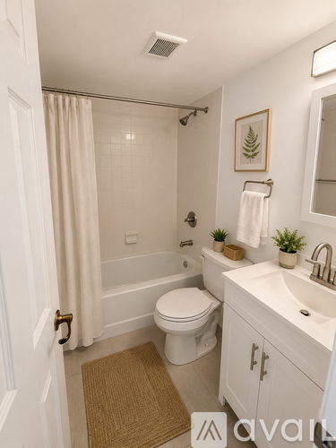 A room with wooden flooring and a ceiling fan.
