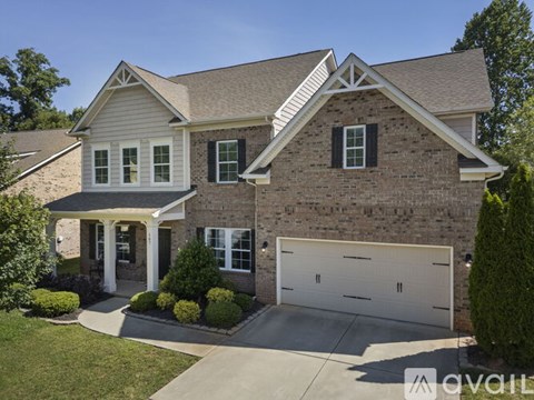 A house with a garage and a driveway.