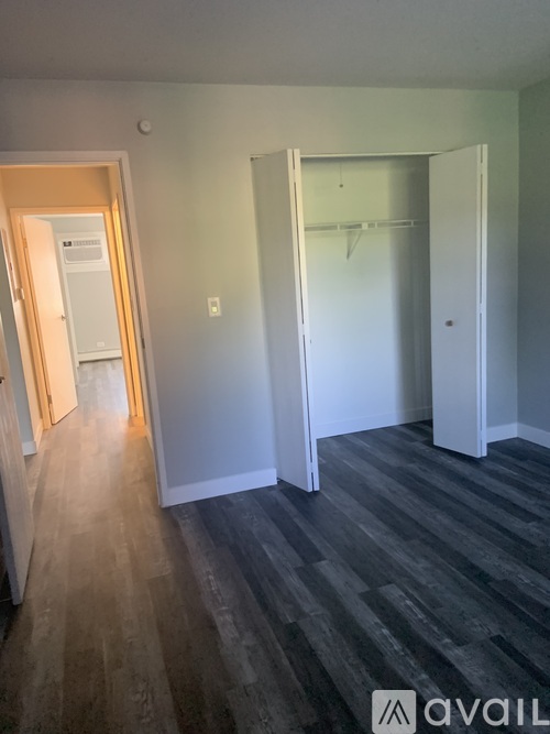 A room with a grey floor and white walls.