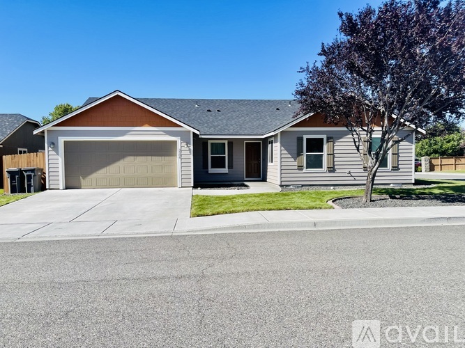 A real estate advertisement for a home rental in Kennewick, WA.
