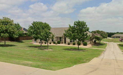 A residential area with houses and trees.