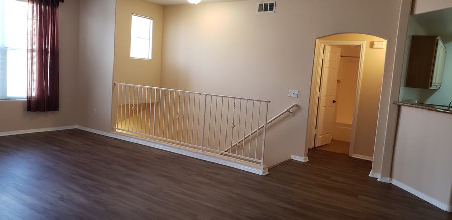 A room with a staircase and a window.
