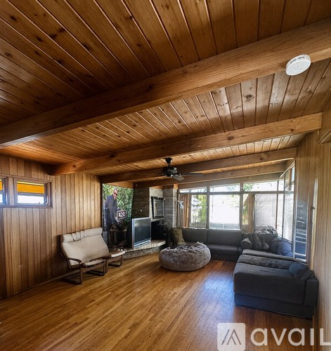 A living room with a fireplace and a couch.