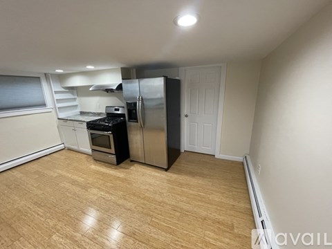 A kitchen with a stove, oven, and refrigerator.