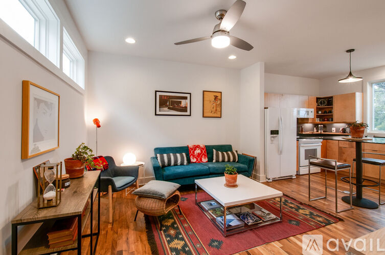 A living room with a blue couch and a coffee table.