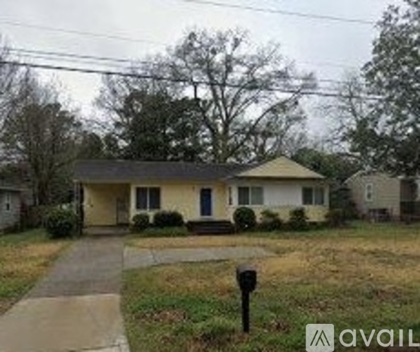 A house with a blue door is for sale.