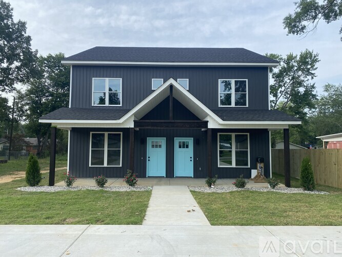 A house with a blue door and windows.