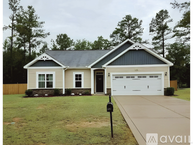 A house with a garage is available for sale.