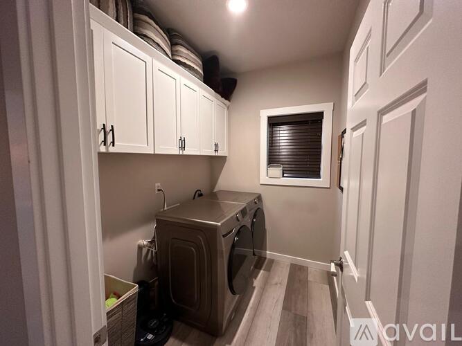 A laundry room with a washer and dryer.