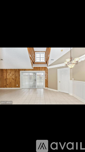 A room with wooden walls and a large open space.