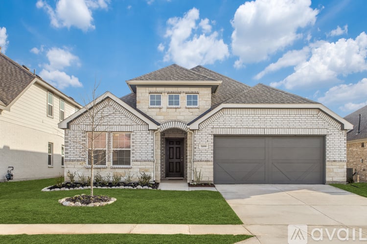 A house with a garage and a driveway is available for sale.