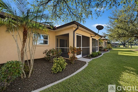 A house with a well-maintained lawn and landscaping.