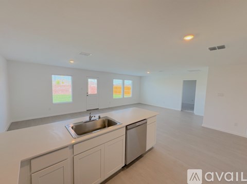 A kitchen with a sink and cabinets is available for rent.