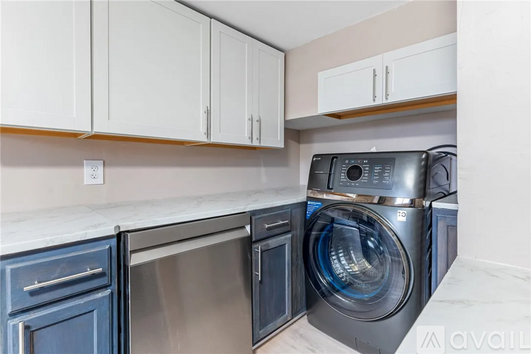 A modern laundry room with a washer and dryer.