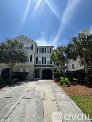 A large house with a driveway in front of it.
