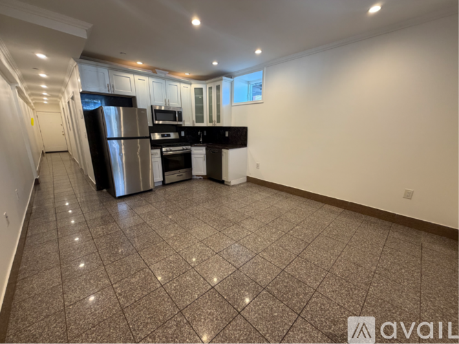 A kitchen with granite countertops and stainless steel appliances.