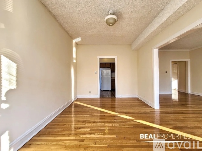 A room with wooden floors and a white ceiling.