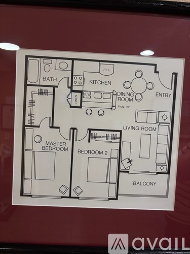 A drawing of a floor plan for a house with a living room, dining room, kitchen, pantry, two bedrooms, a bathroom, and a balcony.