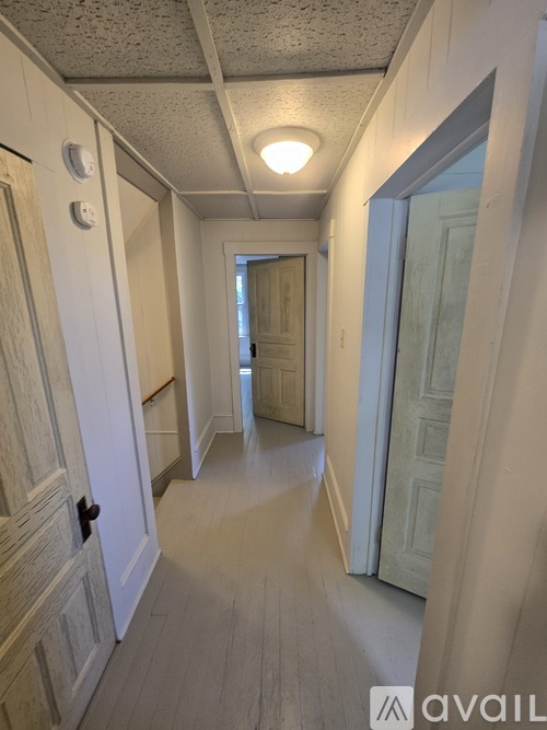 A long hallway with doors on both sides.