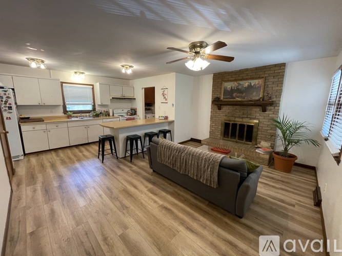 A living room with a fireplace and a couch.