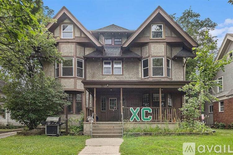 A house with the letters "XC" on the front door.