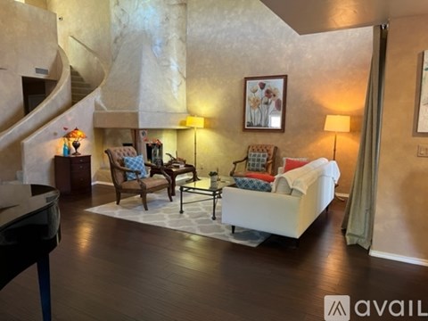 A living room with a piano and a couch.