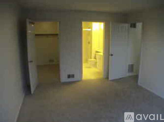 A room with a doorway leading to another room.