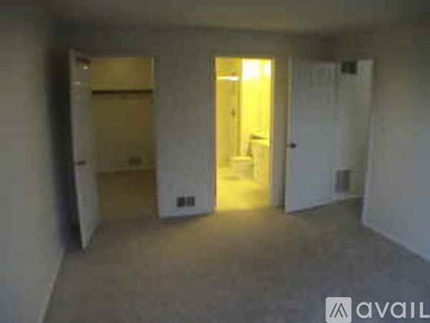 A room with a doorway leading to another room.