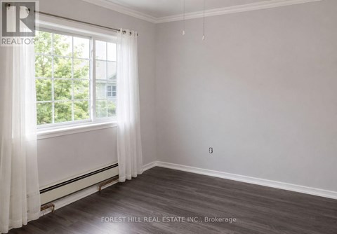 A room with a window and curtains, with a Forest Hill Real Estate Inc. logo and Brokerage text.