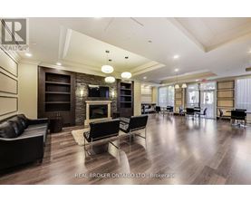 A spacious living room with a fireplace and a television.