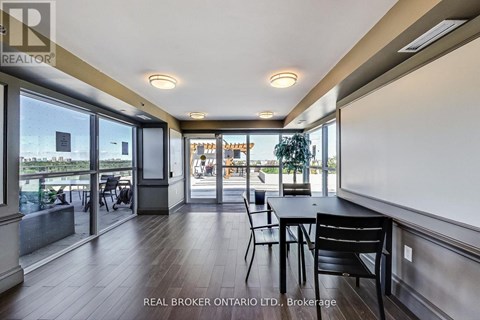 A dining area with a table and chairs is shown in the image.