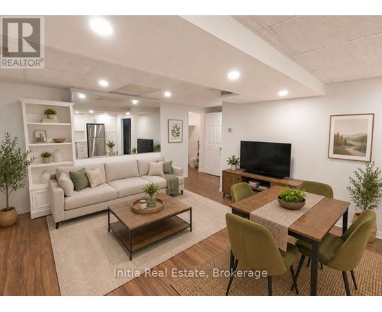 A well-lit living room with a couch, chairs, and a coffee table.