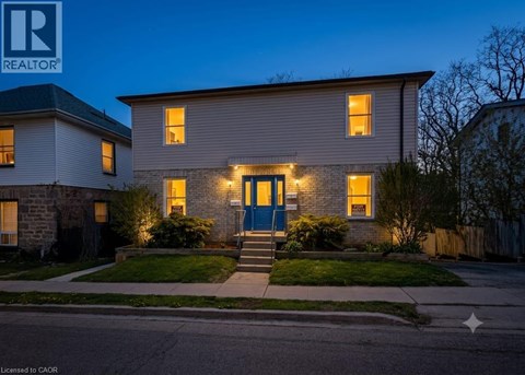 A house with a blue door is shown in the image.
