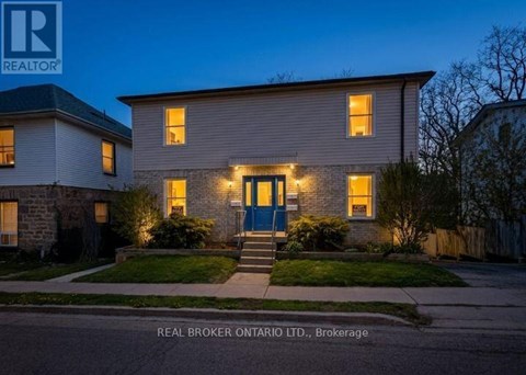 A house with a blue door is shown in the image.