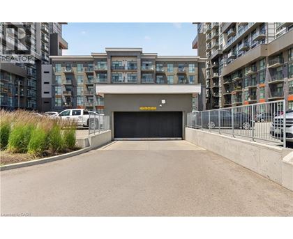 A large black garage door is the centerpiece of this image.